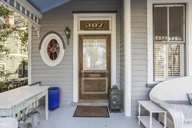 doorway to property featuring a porch