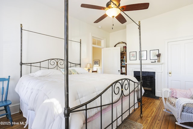 bedroom featuring wood-type flooring and ceiling fan