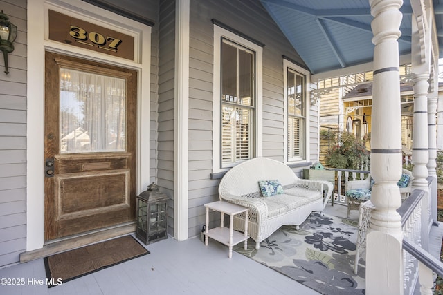 view of exterior entry with covered porch