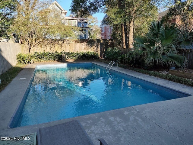 view of swimming pool with a fenced backyard and a fenced in pool