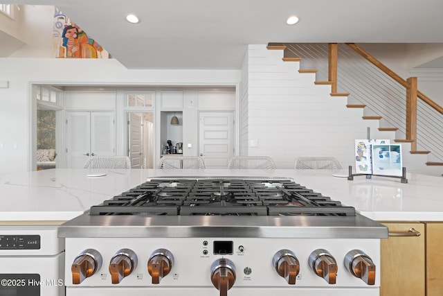 kitchen featuring light stone countertops and gas stovetop