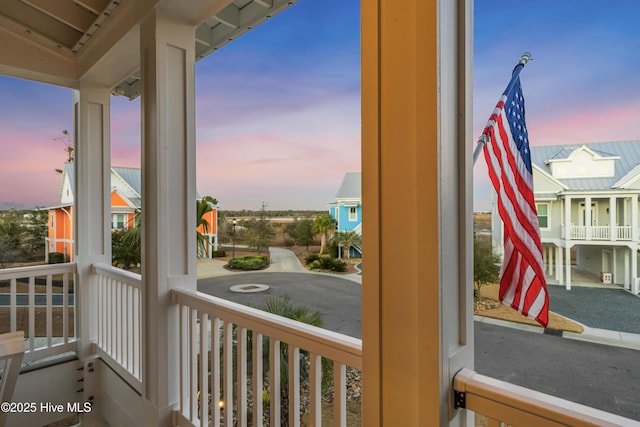 view of balcony at dusk