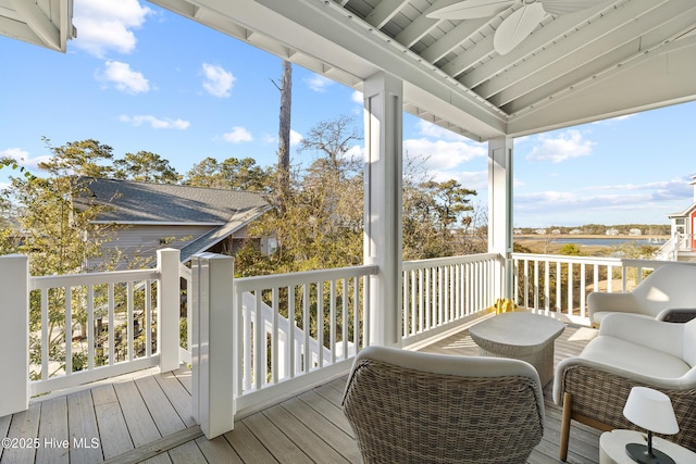 wooden deck featuring ceiling fan