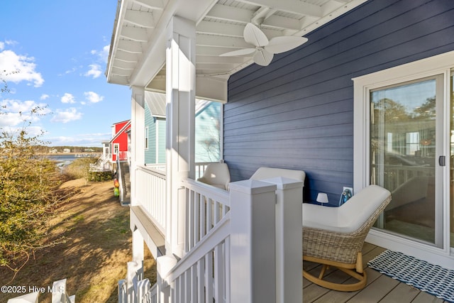 wooden terrace featuring ceiling fan