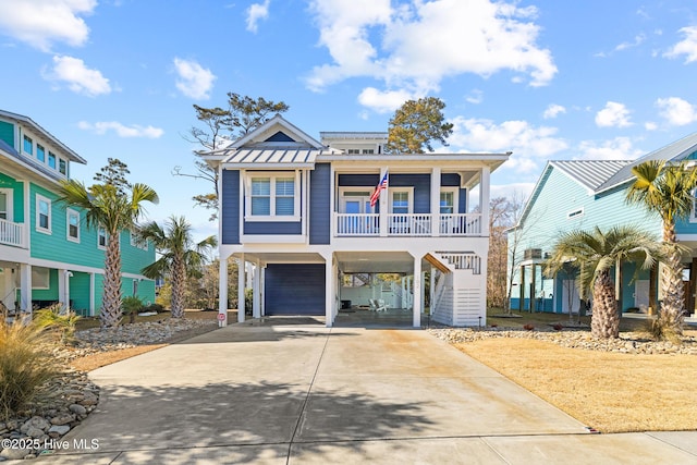 raised beach house with covered porch and a carport