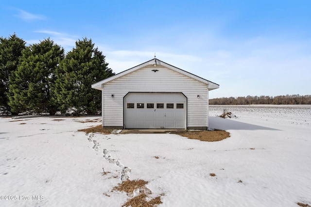 view of snow covered garage