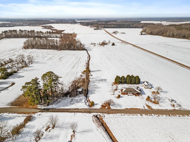 snowy aerial view with a rural view