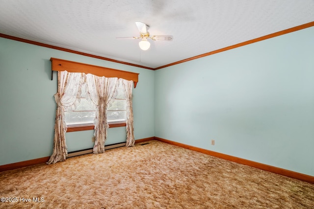 spare room featuring crown molding, carpet floors, a textured ceiling, and ceiling fan