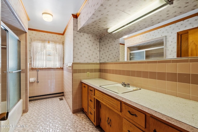 bathroom with crown molding, shower / bath combination with glass door, tile walls, tile patterned flooring, and vanity