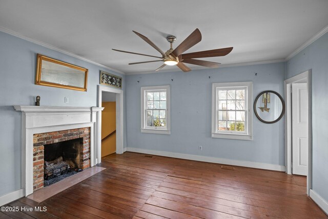 unfurnished living room with crown molding, ceiling fan, a fireplace, and hardwood / wood-style flooring