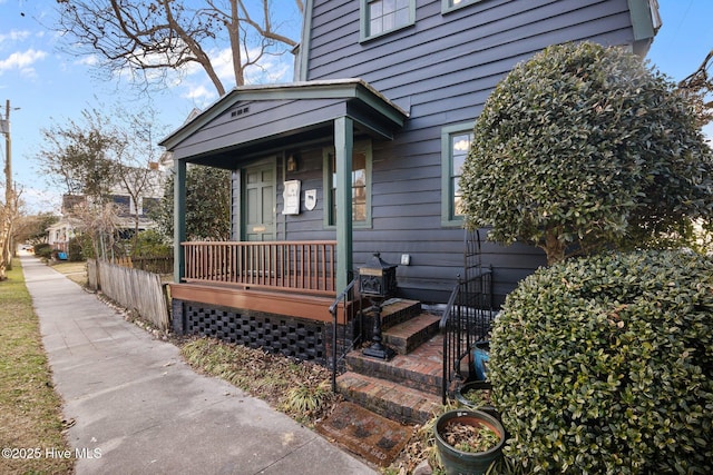 doorway to property featuring covered porch