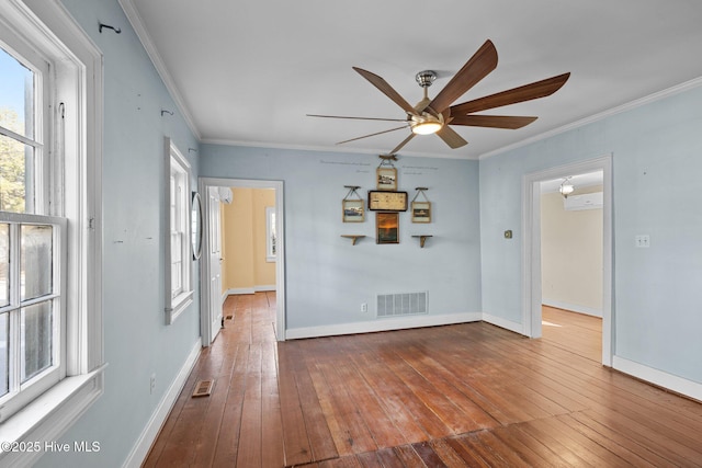 empty room with crown molding, ceiling fan, and wood-type flooring