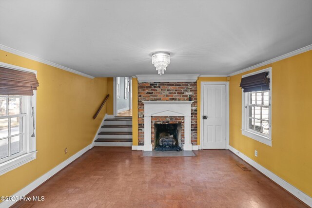 spare room with a notable chandelier and crown molding