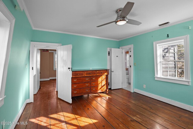 unfurnished bedroom featuring ornamental molding, dark hardwood / wood-style floors, and ceiling fan