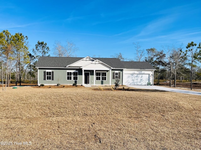 view of front facade with a garage and a front yard