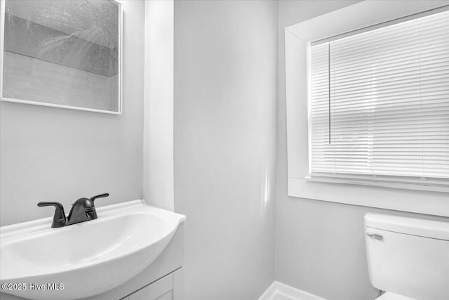 bathroom featuring sink and toilet