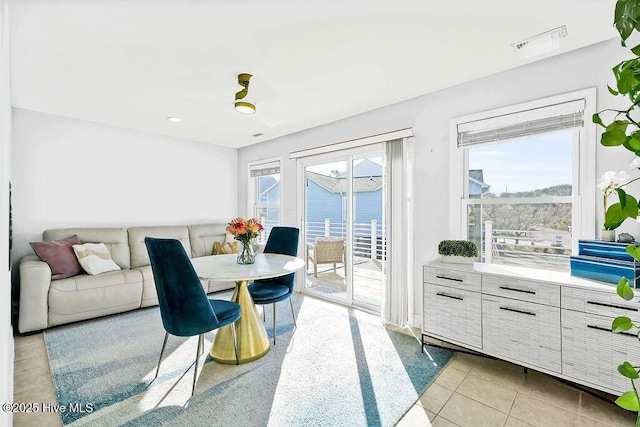 dining room with light tile patterned floors and visible vents