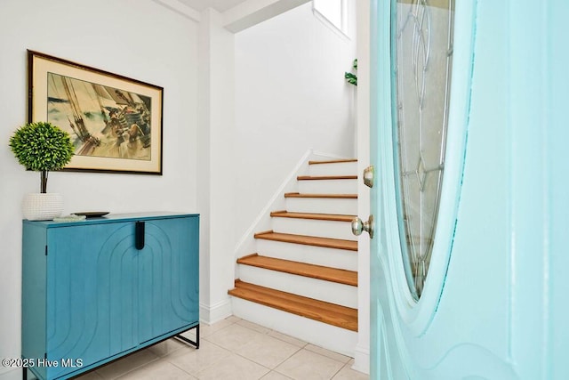 staircase with tile patterned floors