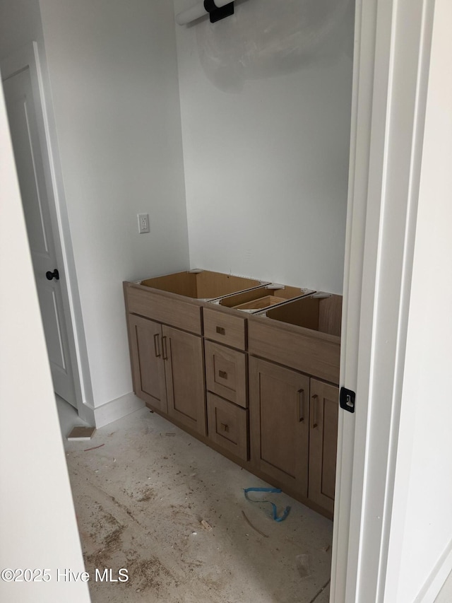 bathroom featuring concrete flooring