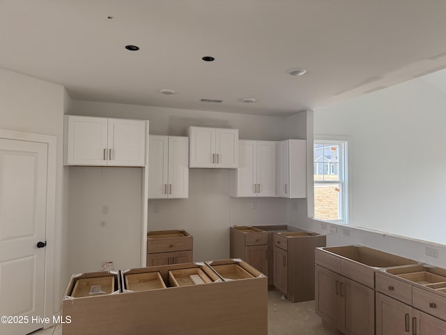 kitchen featuring white cabinetry and a kitchen island