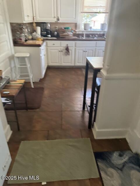 kitchen featuring white cabinets