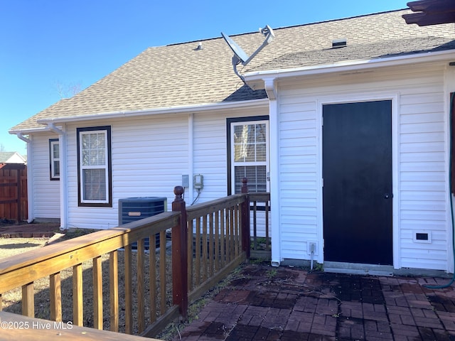 back of house featuring central air condition unit