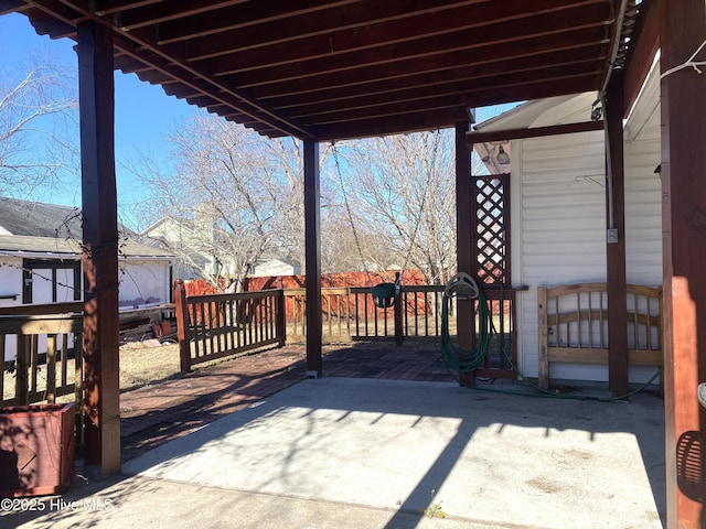 wooden terrace featuring a patio