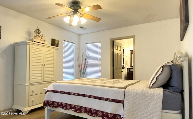 bedroom with hardwood / wood-style floors and ceiling fan