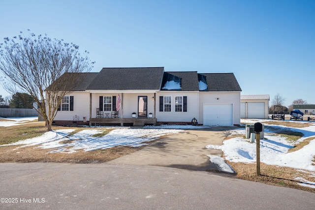 cape cod-style house featuring a garage