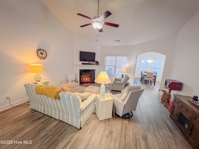 living room featuring hardwood / wood-style floors and ceiling fan