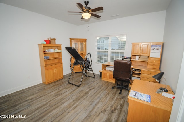 home office with hardwood / wood-style floors and ceiling fan