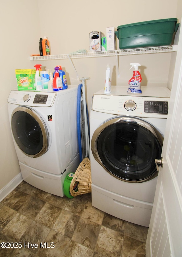 clothes washing area featuring washing machine and dryer