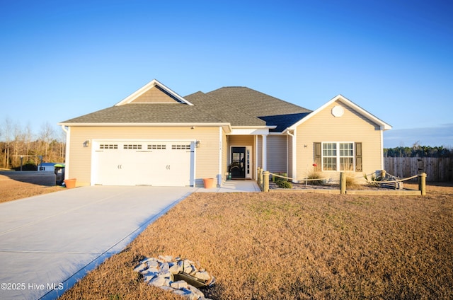 ranch-style home featuring a garage and a front yard