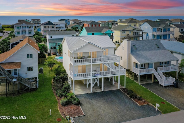 aerial view at dusk with a water view