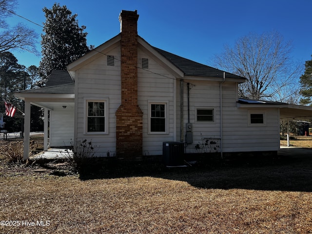 back of house featuring central AC