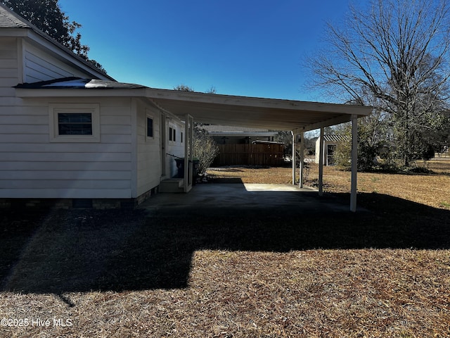 view of vehicle parking with a carport