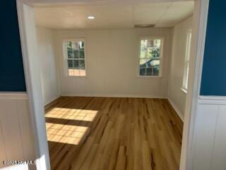 empty room with hardwood / wood-style floors