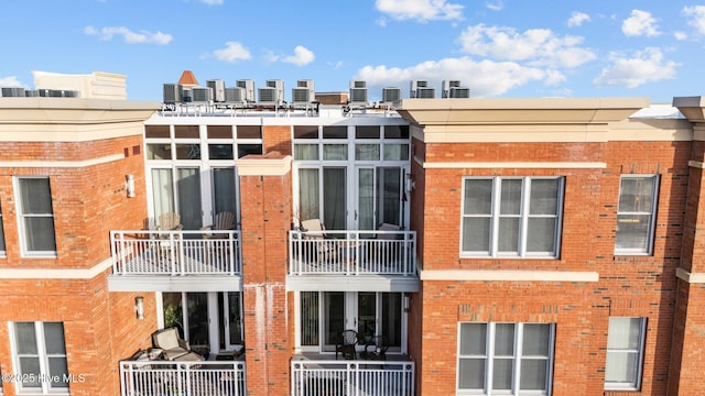 view of building exterior featuring central AC unit