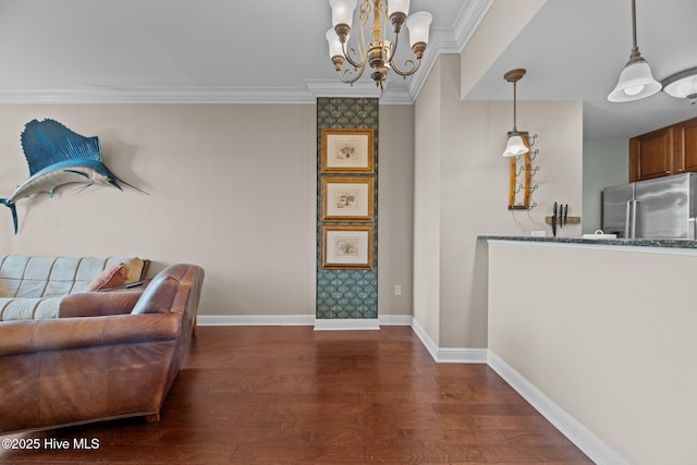 living area with crown molding, a notable chandelier, and dark hardwood / wood-style flooring