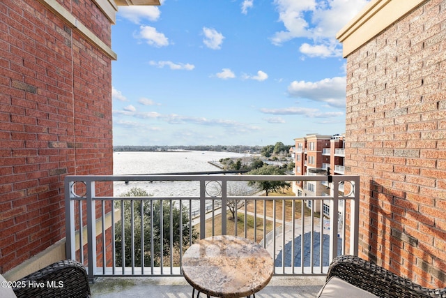 balcony featuring a water view