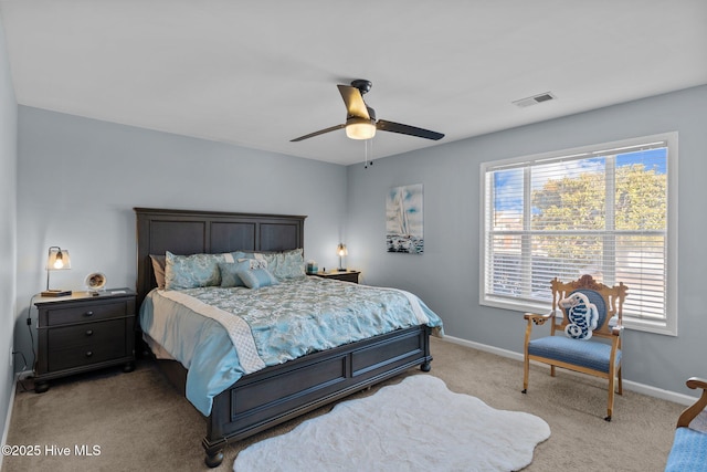 bedroom featuring light colored carpet and ceiling fan