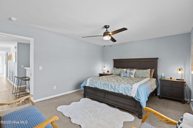 carpeted bedroom featuring ceiling fan