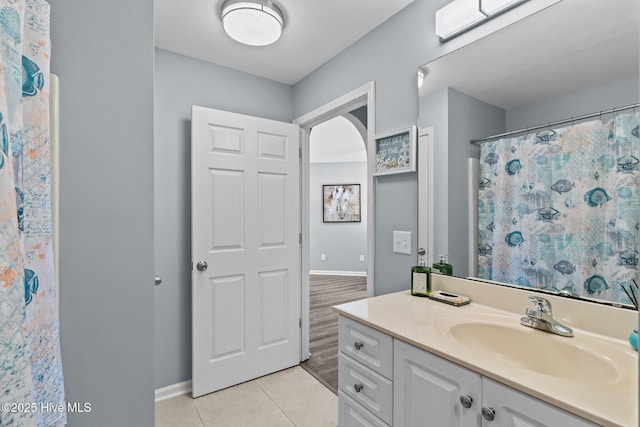 bathroom with vanity, tile patterned floors, and a shower with shower curtain