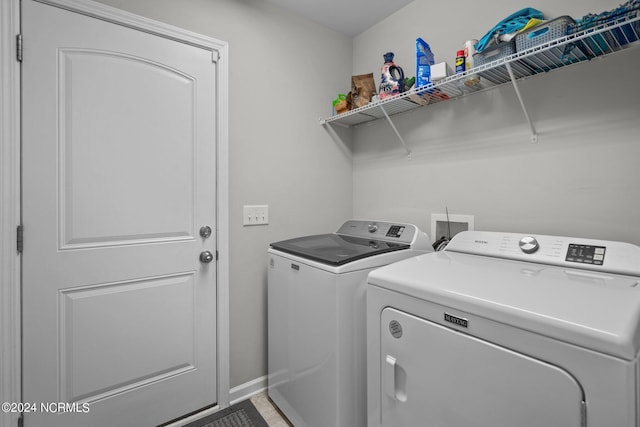 washroom with independent washer and dryer