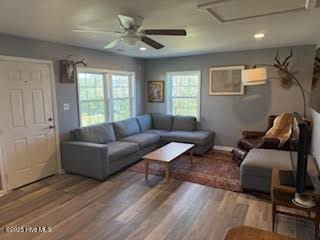 living room featuring hardwood / wood-style flooring and ceiling fan