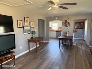 dining space featuring dark hardwood / wood-style floors and ceiling fan