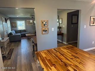 dining area with dark hardwood / wood-style floors