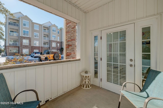 balcony featuring french doors and a sunroom