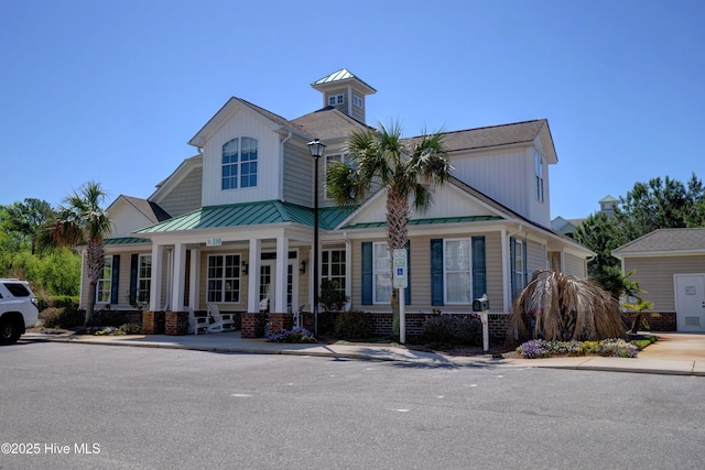 view of front of house featuring a porch and a standing seam roof