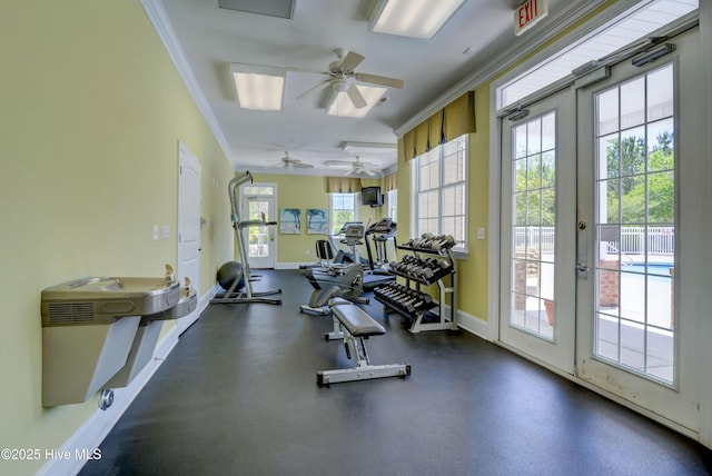 gym with french doors, ornamental molding, and baseboards